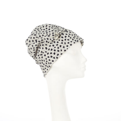 Nerida Fraiman - Pure Japanese cotton beanie in black and ivory print with bumblebee pin detail